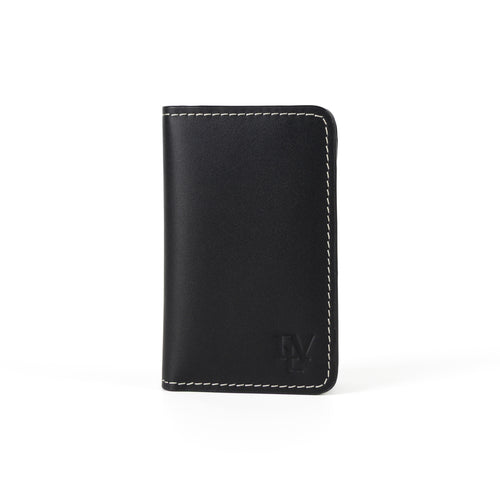 Minimal Card Holder, Black, front view: smooth black leather, contrast stitching, ELV monogram debossed near the bottom edge.
