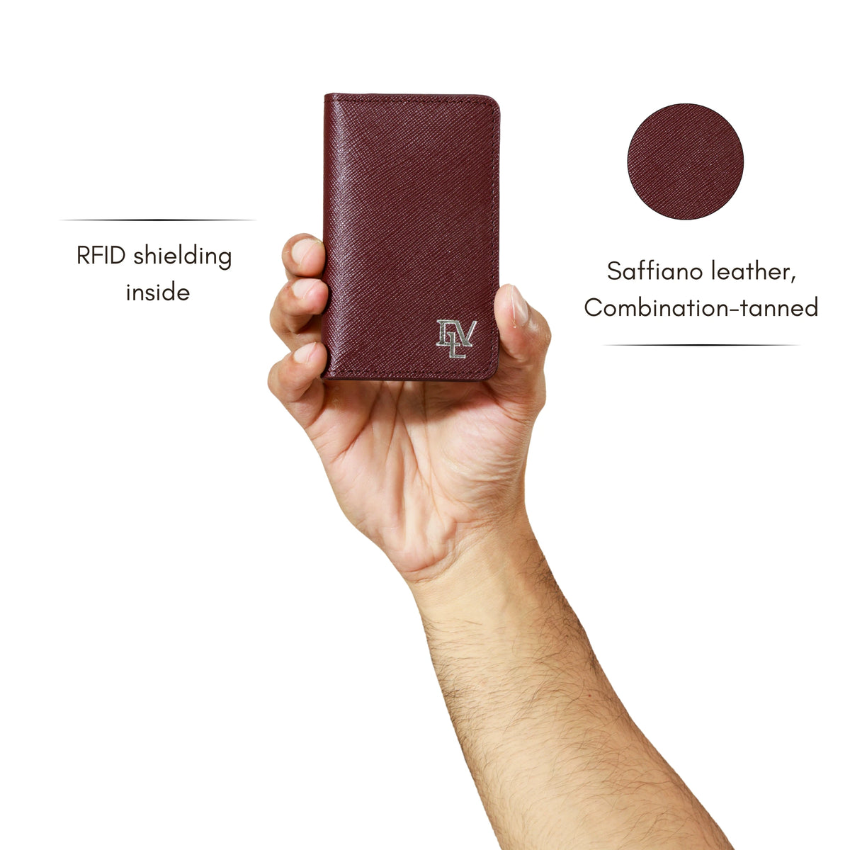 Saffiano Card Holder in Burgundy held in one hand. Notes: RFID shielding inside; Saffiano leather, combination-tanned.