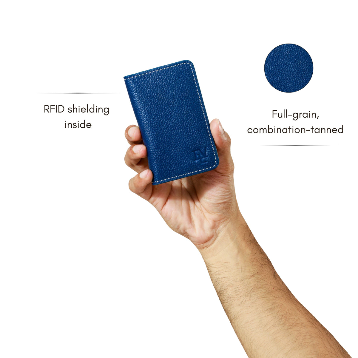 Everyday Card Holder in Alpine Blue held in one hand. Notes: RFID shielding inside; full-grain, combination-tanned leather.